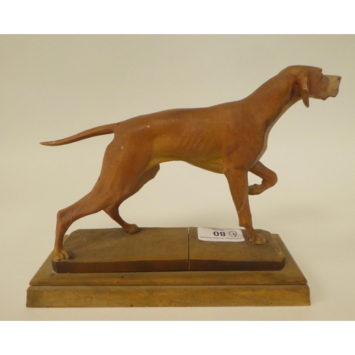 80 - A carved softwood sculpture, a gun dog, on a plinth  bears the signature Diller  6