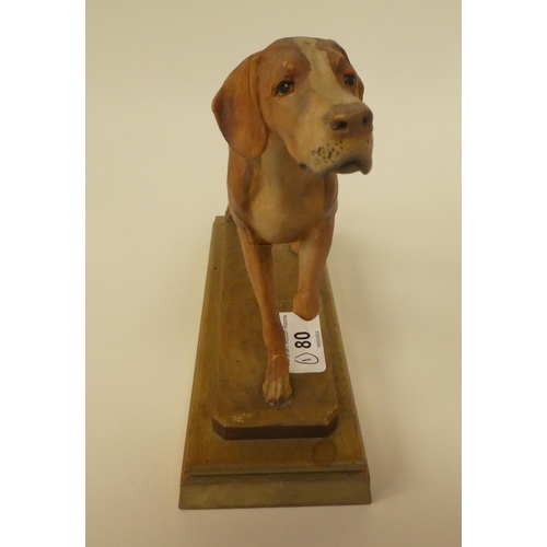 80 - A carved softwood sculpture, a gun dog, on a plinth  bears the signature Diller  6