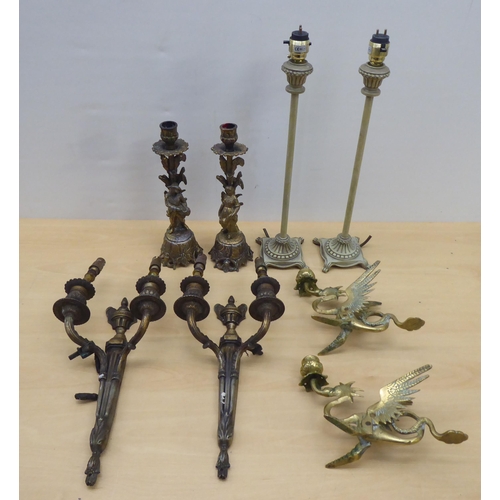 85 - 20thC lighting: to include a pair of cast antique finished brass twin branch appliques  13