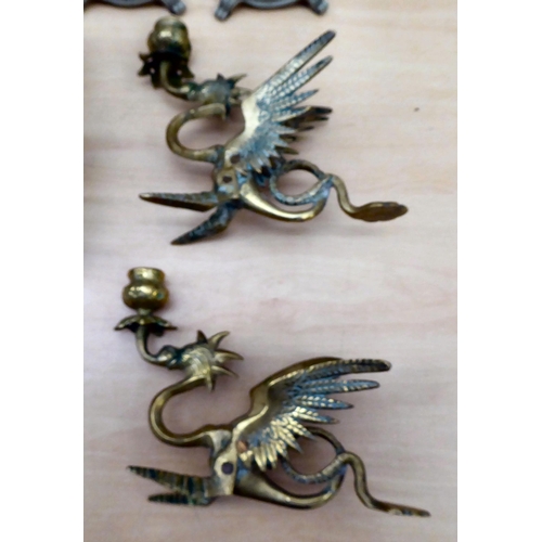 85 - 20thC lighting: to include a pair of cast antique finished brass twin branch appliques  13