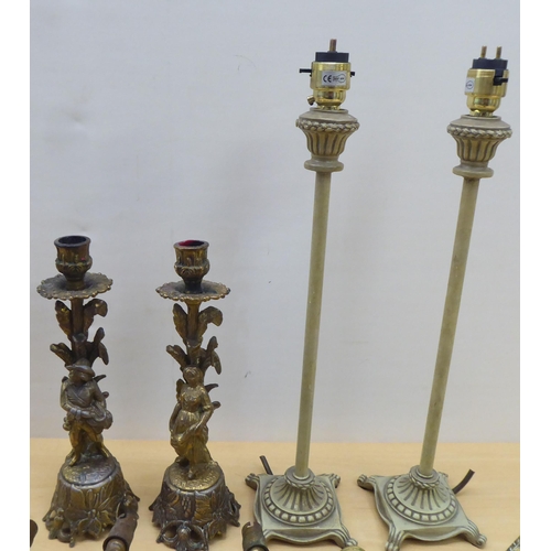 85 - 20thC lighting: to include a pair of cast antique finished brass twin branch appliques  13