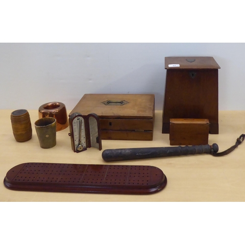 89 - 20thC mainly wooden collectables: to include a horn beaker; and a 1920s oak desk tidy with a fall fr... 