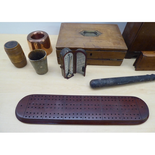 89 - 20thC mainly wooden collectables: to include a horn beaker; and a 1920s oak desk tidy with a fall fr... 