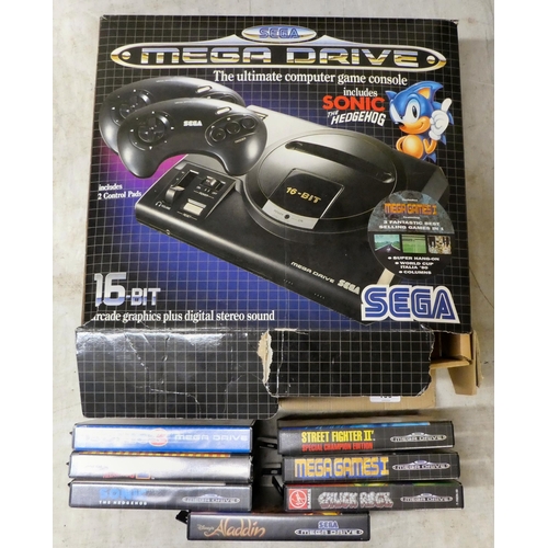 100 - A Sega Mega Drive games console with power pack, two controllers and seven games