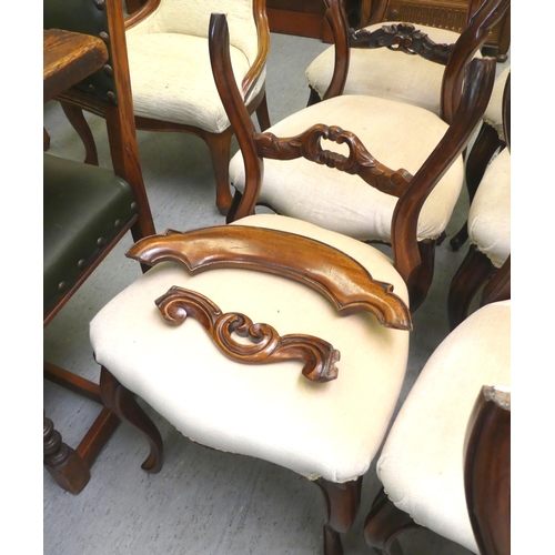 11 - A matched set of ten late Victorian carved mahogany framed balloon back dining chairs with overstuff... 