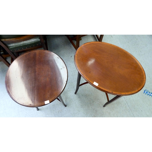 12 - An Edwardian crossbanded mahogany occasional table, raised on square, tapered legs  28