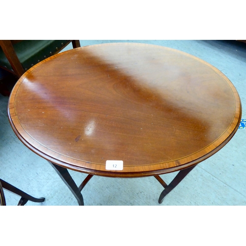 12 - An Edwardian crossbanded mahogany occasional table, raised on square, tapered legs  28