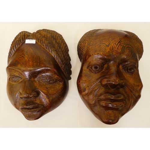 131 - Two African carved hardwood face masks&nbsp; approx. 17