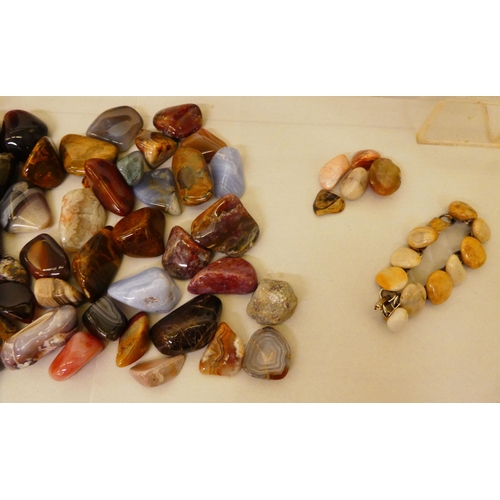 132 - A quantity of hardstone, agate and other carved egg ornaments; and variously cut stones and smaller ... 