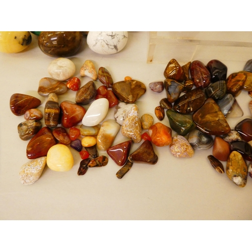 132 - A quantity of hardstone, agate and other carved egg ornaments; and variously cut stones and smaller ... 