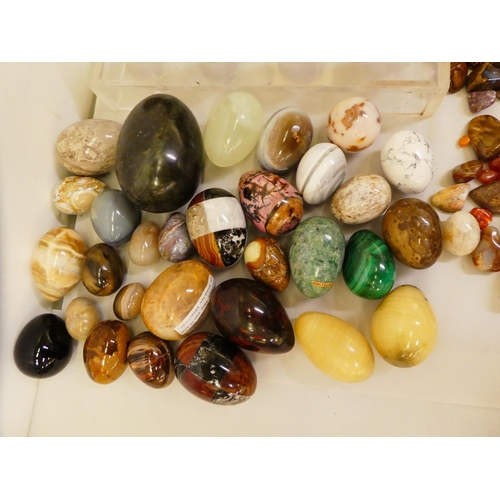 132 - A quantity of hardstone, agate and other carved egg ornaments; and variously cut stones and smaller ... 