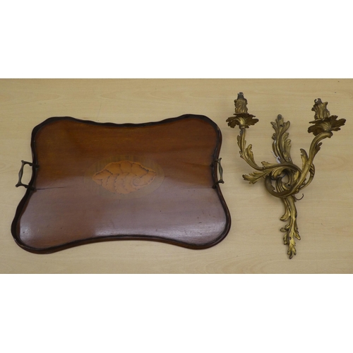 133 - A late Victorian/Edwardian mahogany galleried serving tray of serpentine outline with a central shel... 
