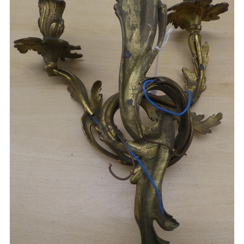 133 - A late Victorian/Edwardian mahogany galleried serving tray of serpentine outline with a central shel... 