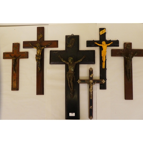 136 - Six dissimilar crucifixes with variously cast metal Corpus Christi  largest 24