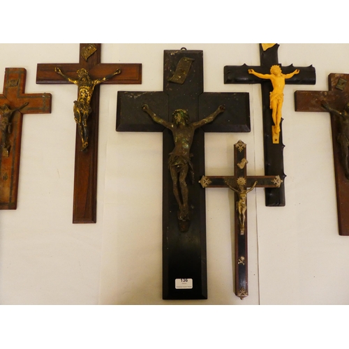 136 - Six dissimilar crucifixes with variously cast metal Corpus Christi  largest 24