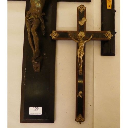 136 - Six dissimilar crucifixes with variously cast metal Corpus Christi  largest 24