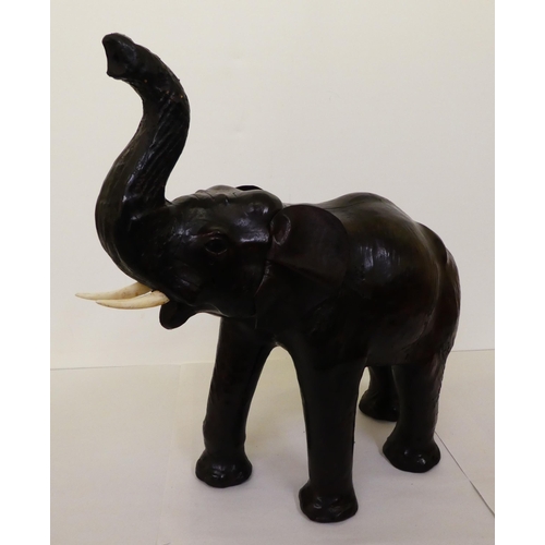 137 - A Liberty's inspired, moulded and stained leather model, a trumpeting elephant&nbsp; 21