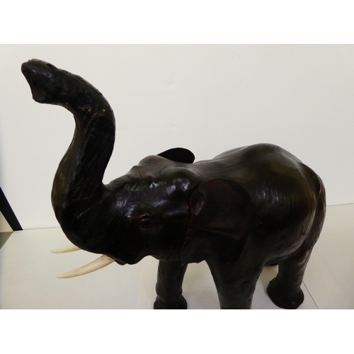137 - A Liberty's inspired, moulded and stained leather model, a trumpeting elephant&nbsp; 21