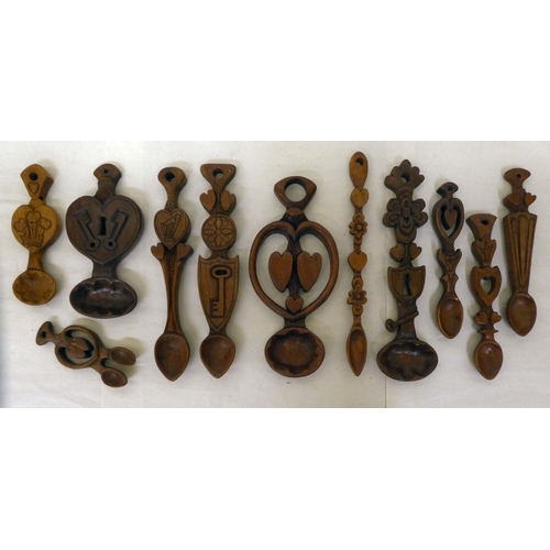 142 - Ten country made carved love spoons of varying, individual design&nbsp; largest 12