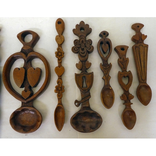 142 - Ten country made carved love spoons of varying, individual design&nbsp; largest 12