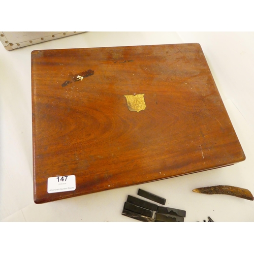 147 - A box of restoration materials: to include fragments of tortoiseshell, bone and mother-of-pearl