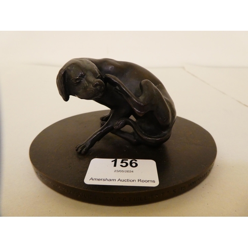 156 - A 1960s cast and patinated bronze model, a seated hound, scratching its ears&nbsp; 3.5
