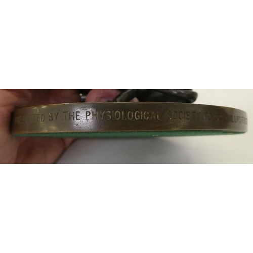 156 - A 1960s cast and patinated bronze model, a seated hound, scratching its ears&nbsp; 3.5