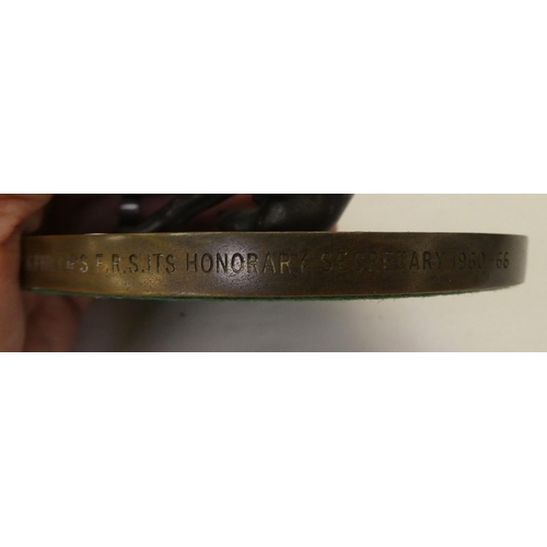 156 - A 1960s cast and patinated bronze model, a seated hound, scratching its ears&nbsp; 3.5