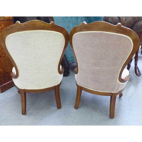 16 - A pair of modern stained beech showwood spoonback bedroom chairs, part button upholstered in cream c... 