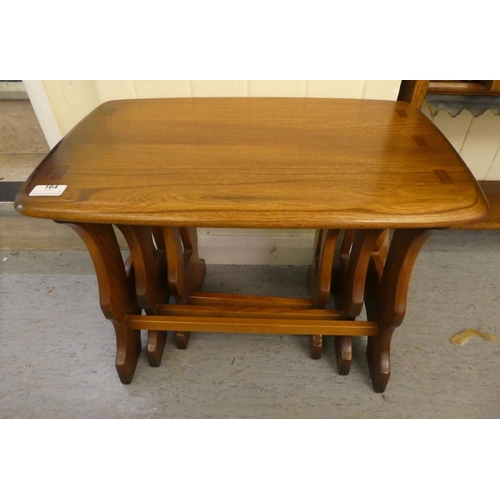 164 - A nesting set of three Ercol Golden Dawn beech and elm, trestle end coffee tables  largest 17
