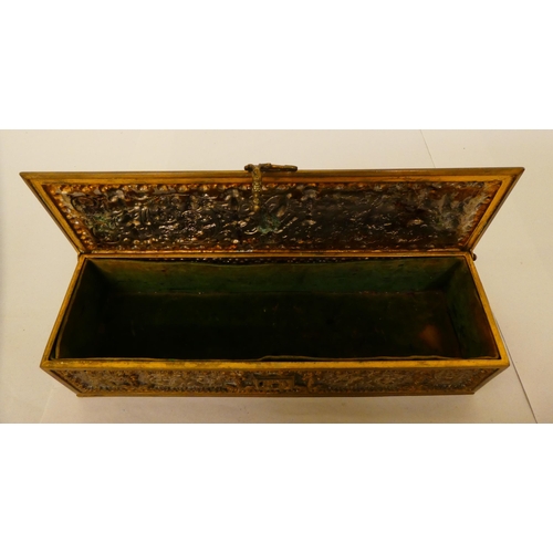 167 - A 19thC brass casket with a hinged lid and clasp, decorated with cherubic figures&nbsp; 3.5