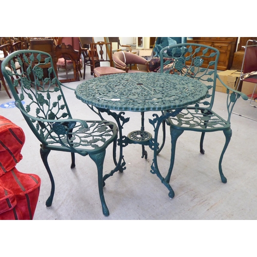 169 - A modern Victorian style green painted patio table&nbsp; 30