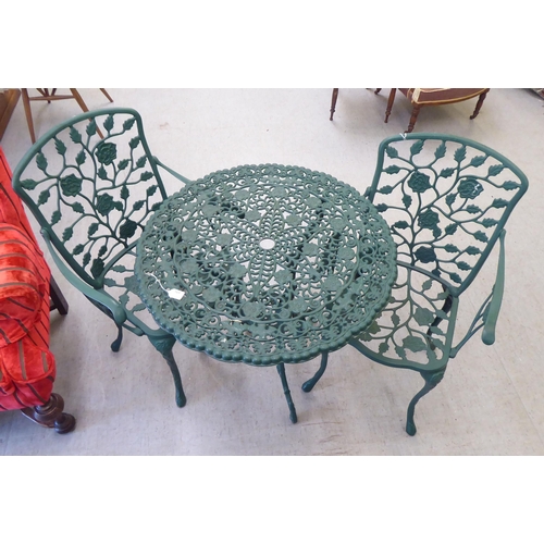 169 - A modern Victorian style green painted patio table&nbsp; 30