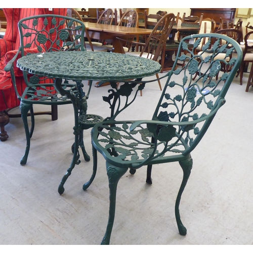 169 - A modern Victorian style green painted patio table&nbsp; 30