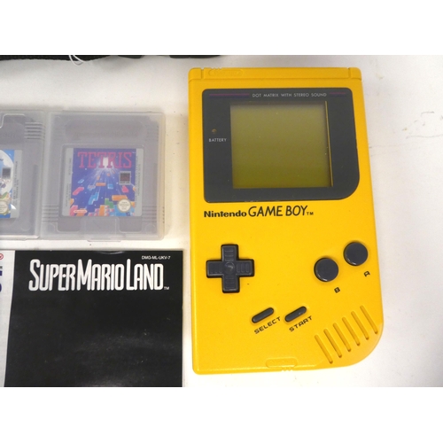 18 - A Nintendo Game Boy with various games, in a soft carrying pouch