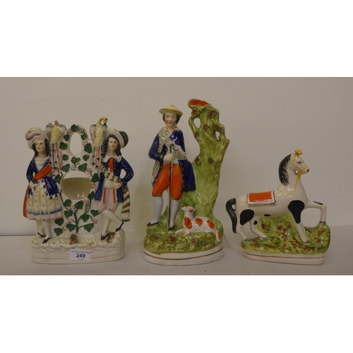 249 - 19thC and later Staffordshire pottery figures and animals: to include a watch case  10