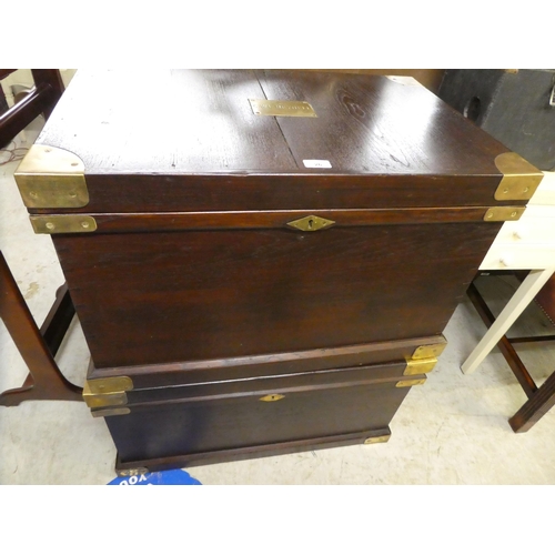 26 - Two modern fruitwood military design chests, each with a hinged lid and brass capped corners, on a p... 