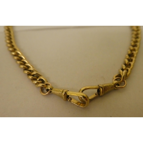 308 - A gold plated pocket watch chain and T-bar