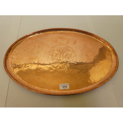 314 - A Hugh Wallis Arts & Crafts oval copper tray with spot hammered and floral decoration  bears imp... 