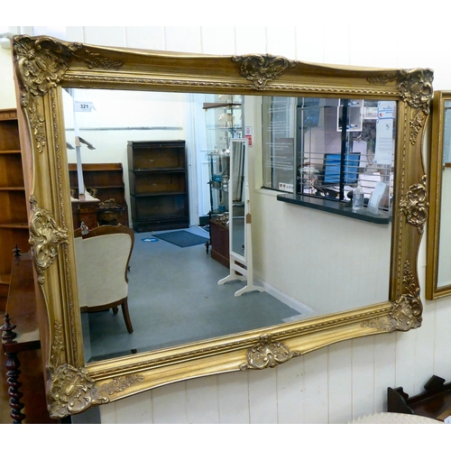 321 - Mirrors: to include a modern example with a bevelled plate, in an ornate gilt frame  43