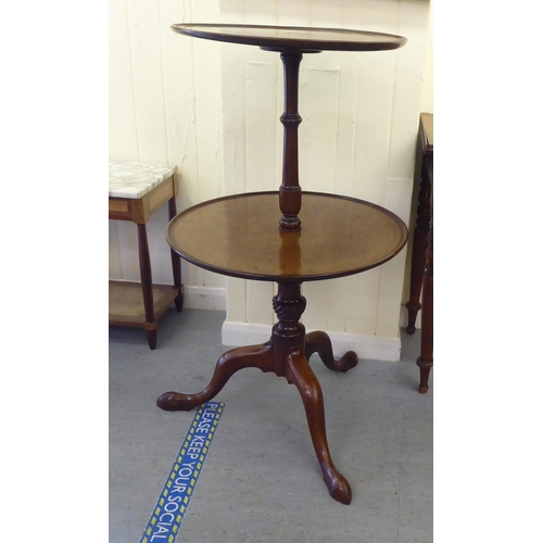 323 - A mid 19thC mahogany dumb waiter, raised on a turned column and tripod base  41