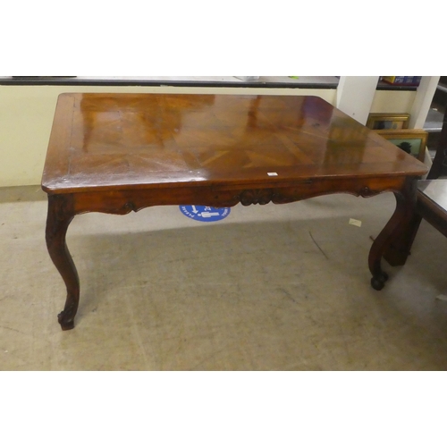 33 - A modern French oak dining table with a parquetry top, raised on cabriole legs  30