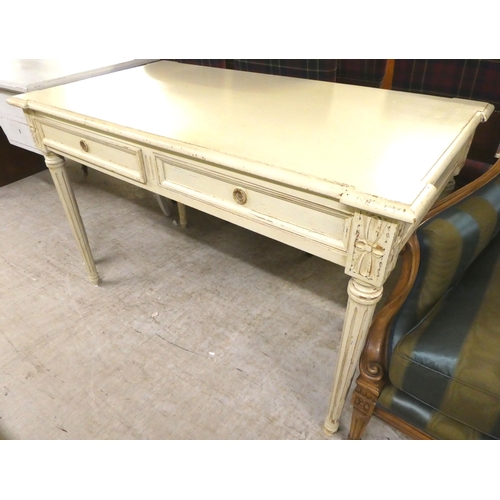 53 - A modern cream painted, distressed oak desk with two drawers, raised on turned, fluted legs  30