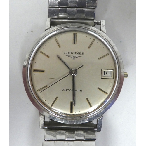 66 - A Longines stainless steel cased and later strapped automatic wristwatch, faced by a baton dial with... 