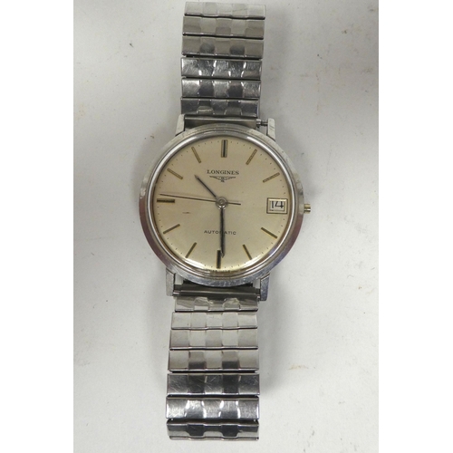 66 - A Longines stainless steel cased and later strapped automatic wristwatch, faced by a baton dial with... 