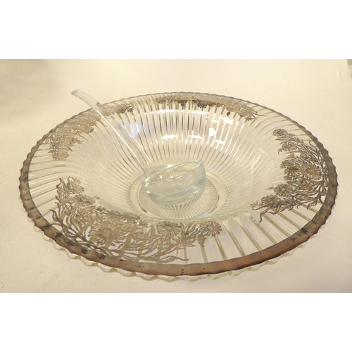 7 - Decoratively gilded and silvered glass tableware: to include a fruit bowl and servers 