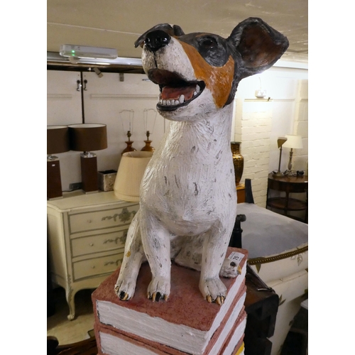 75 - A pottery ornament, fashioned as a Jack Russell, perched on a pile of books  37