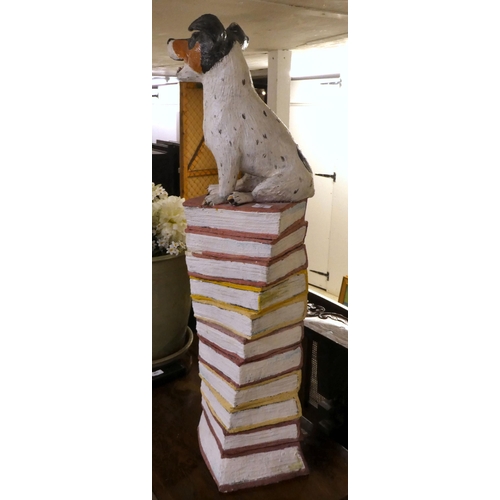 75 - A pottery ornament, fashioned as a Jack Russell, perched on a pile of books  37