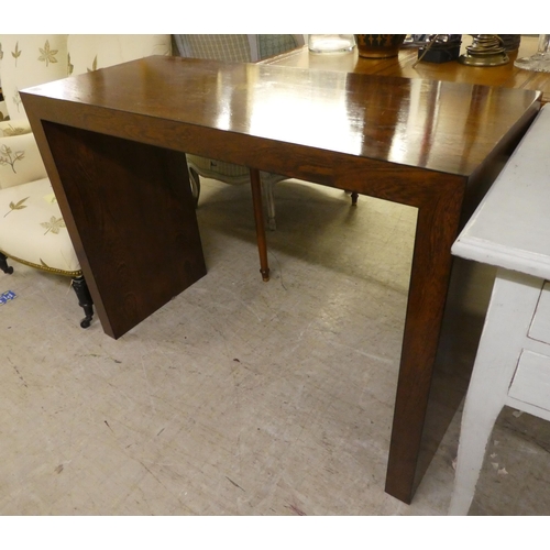 79 - A modern oak finished MDF hall table, raised on planked ends  31