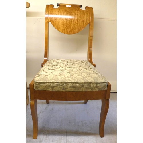 83 - Chairs: to include a modern Biedermeier style, maple finished bedroom chair, raised on splayed legs